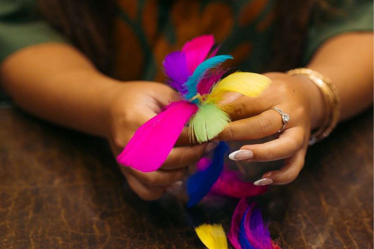 Two parrots on sitting on a tree branch