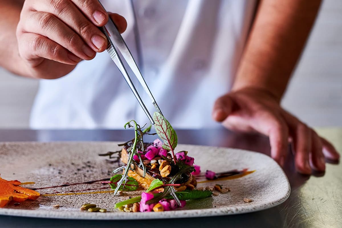 A chef plating