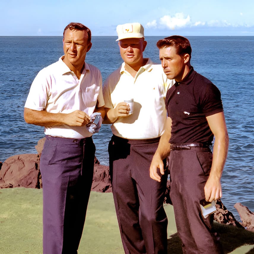 Three golfers look on
