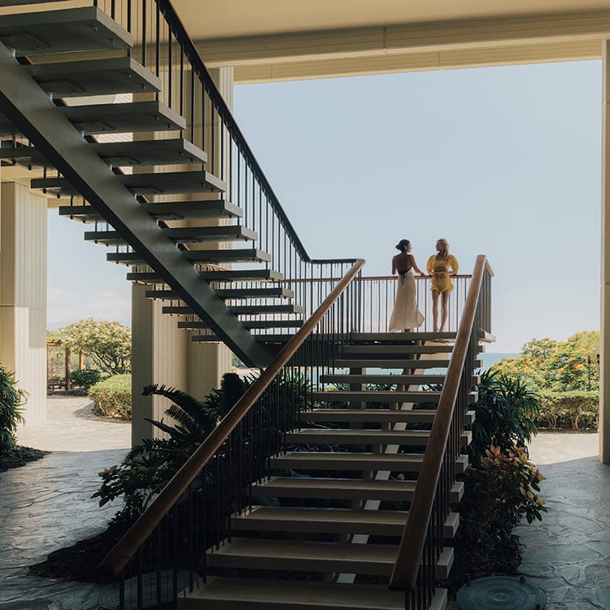 Two women chatting on the staircase