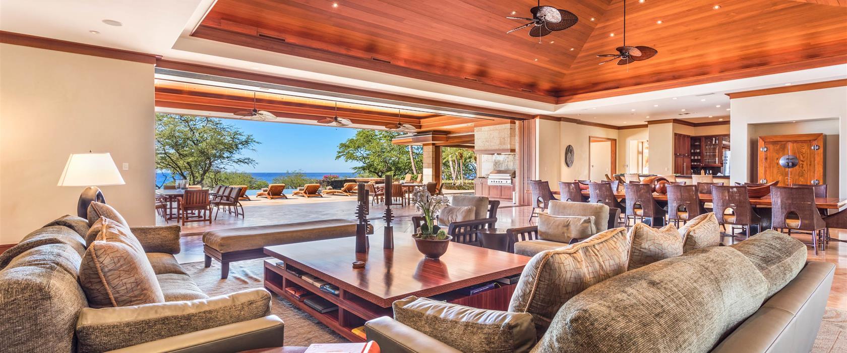 living room and dining room with a beach view