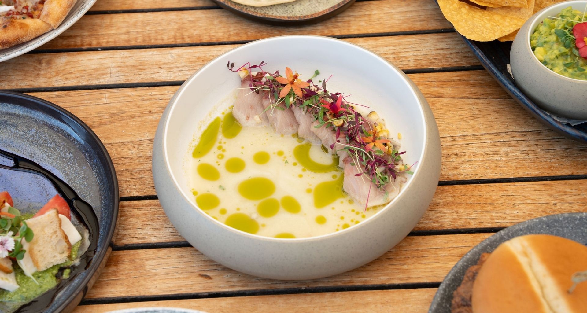 fish topped with colorful garnish 