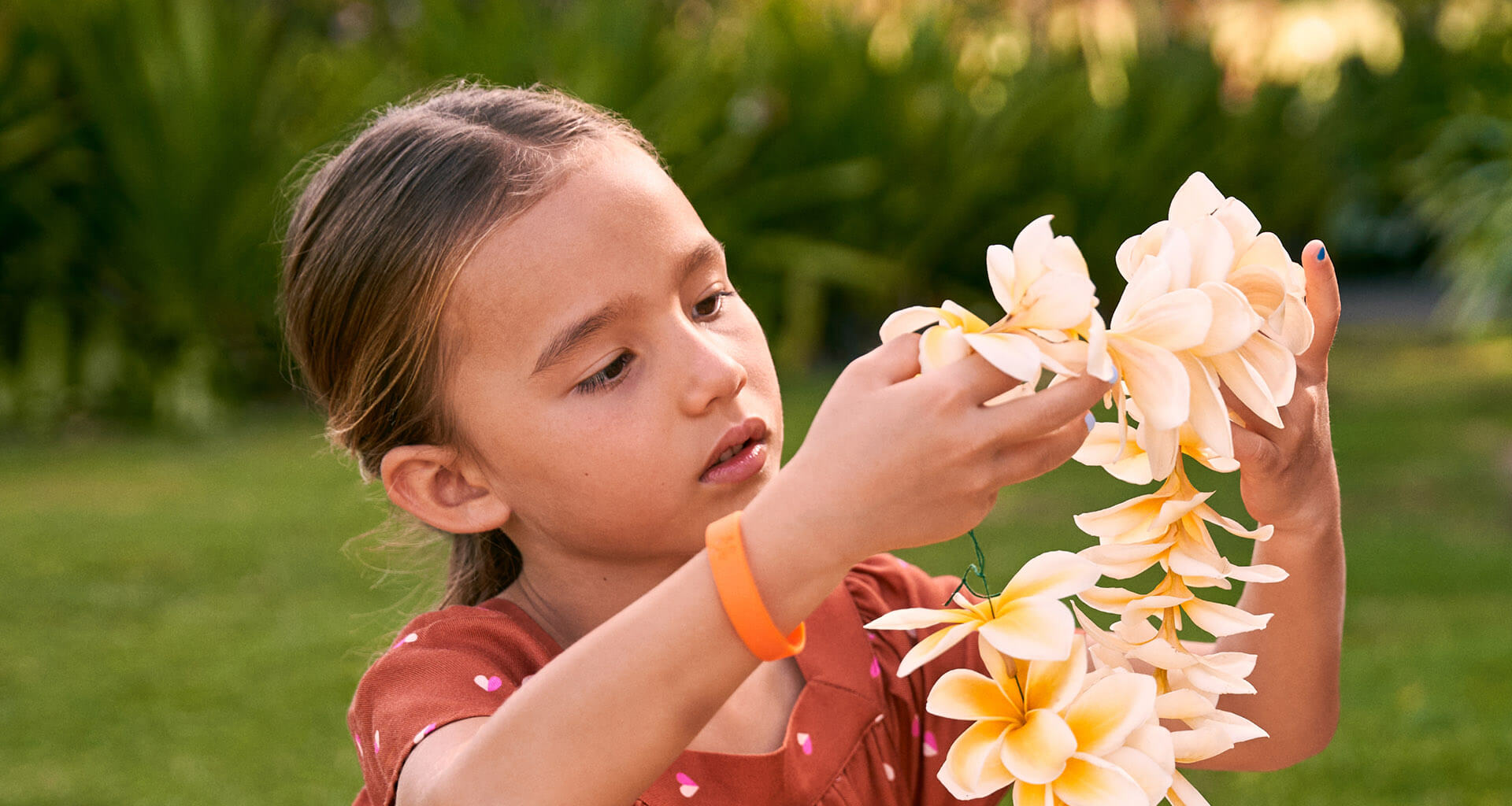 Girl holding a lei