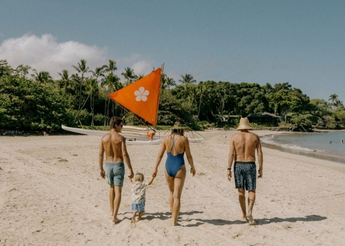 family walking on the beach